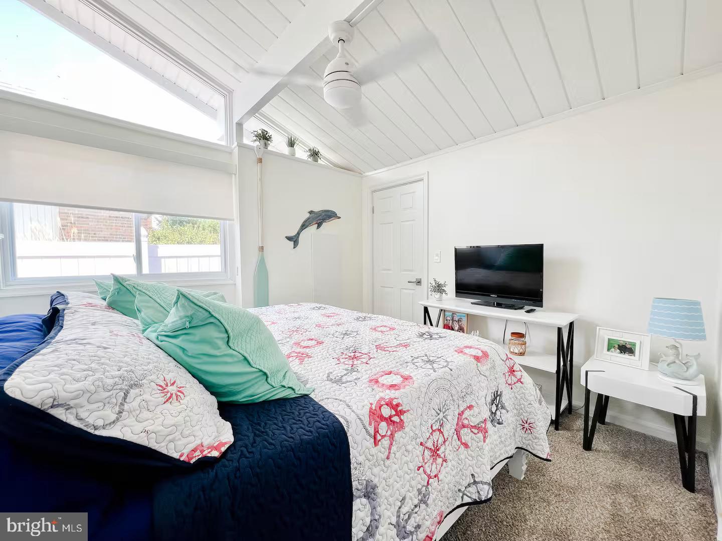 10609 Pine Needle Road Ocean City, MD 21842 - Photo 4 of 26 a bedroom with a bed and a television