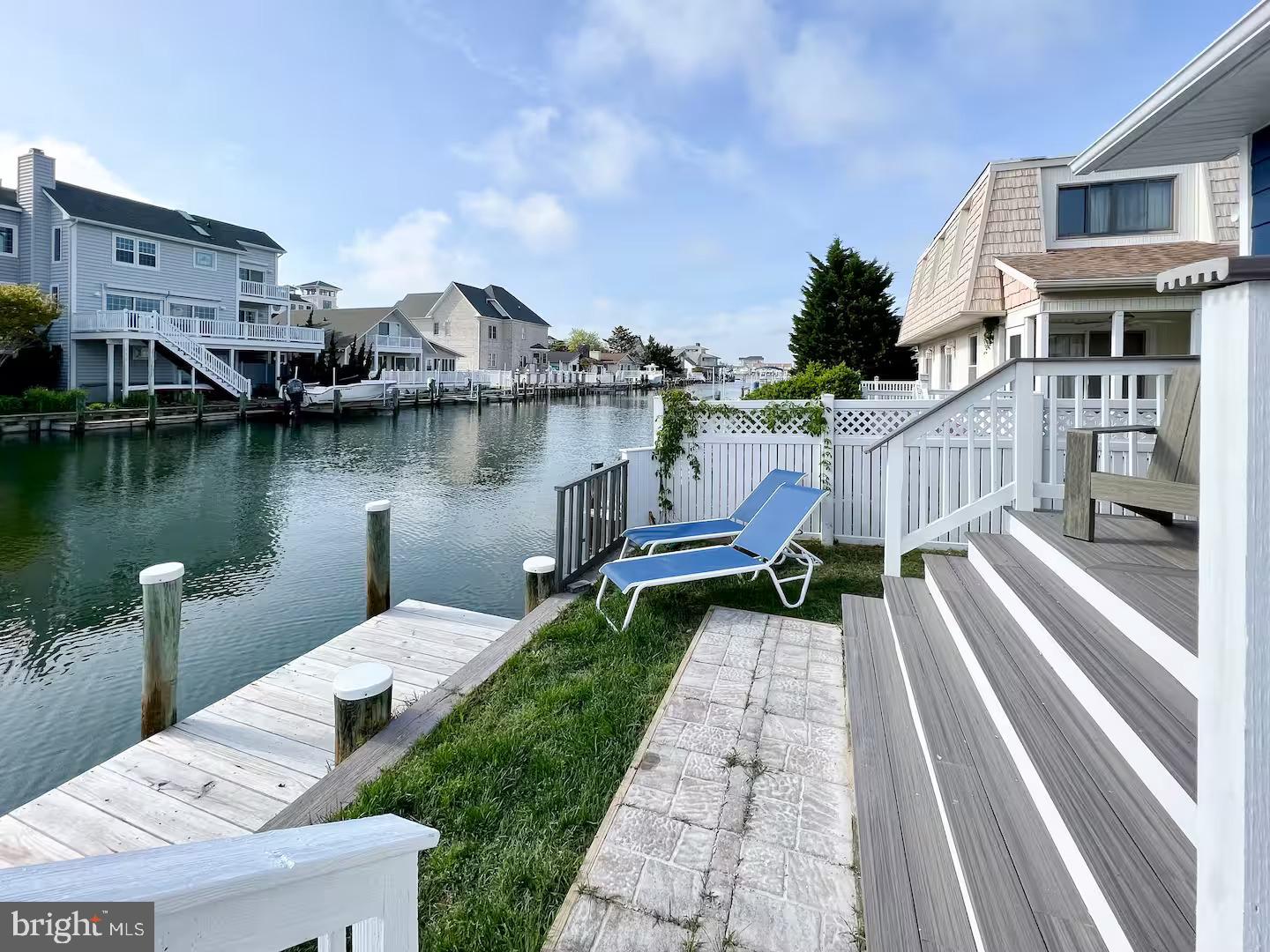 10609 Pine Needle Road Ocean City, MD 21842 - Photo 8 of 26 a front view of a house with a lake view