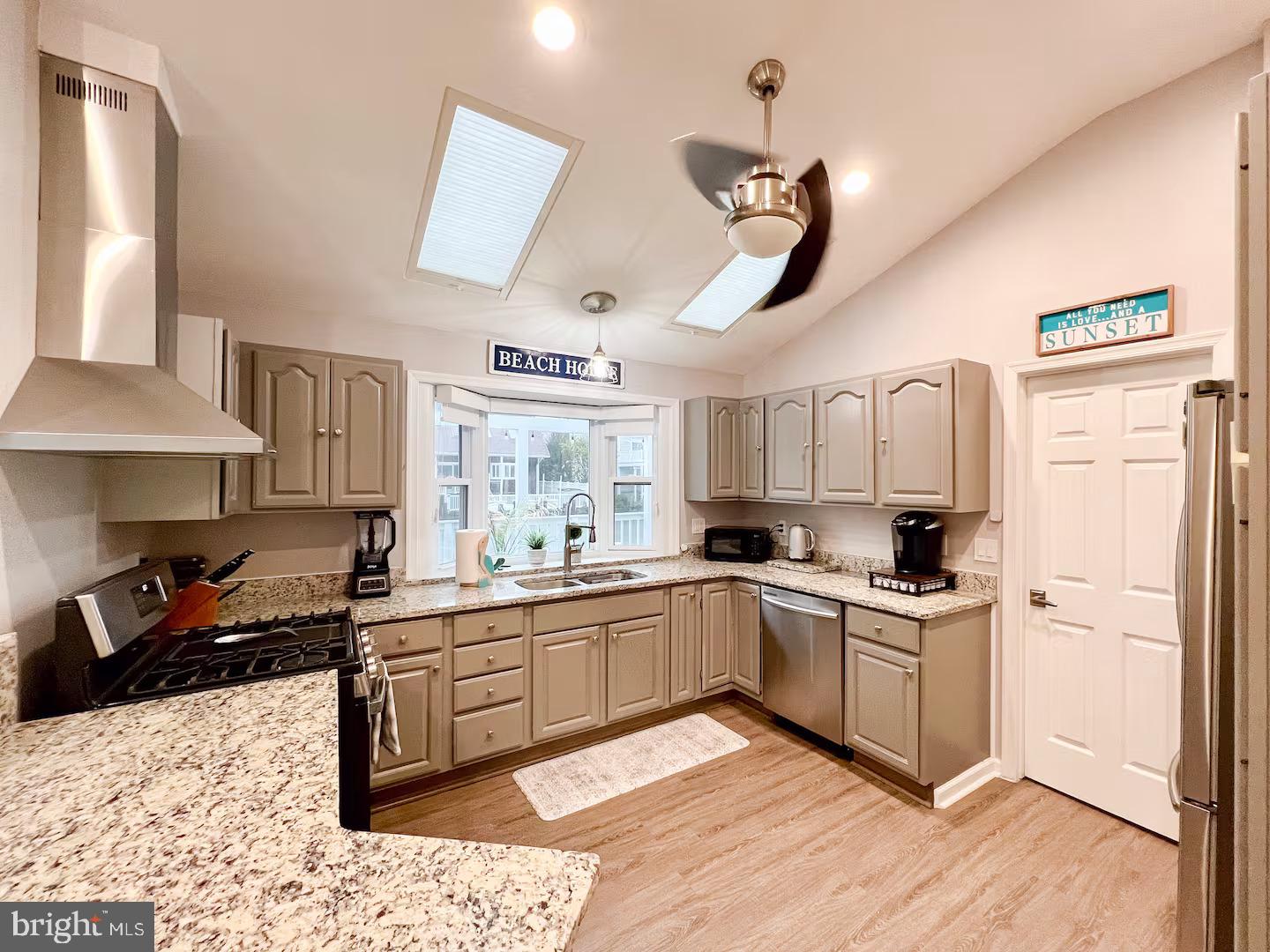 10609 Pine Needle Road Ocean City, MD 21842 - Photo 10 of 26 a kitchen with a sink cabinets and window