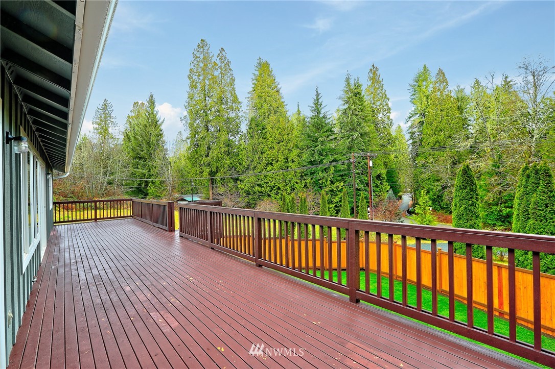 2926 Southwest Lake Roesiger Road Snohomish, WA 98290 - Photo 8 of 27 a view of balcony with wooden floor and outdoor space