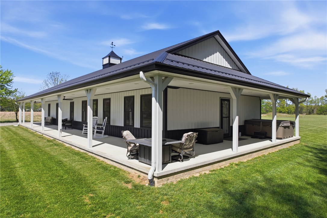 1602 Westboro Road Blanchester, OH 45107 - Photo 12 of 81 This captivating home boasts a broad covered patio, perfect for enjoying peaceful outdoor moments.