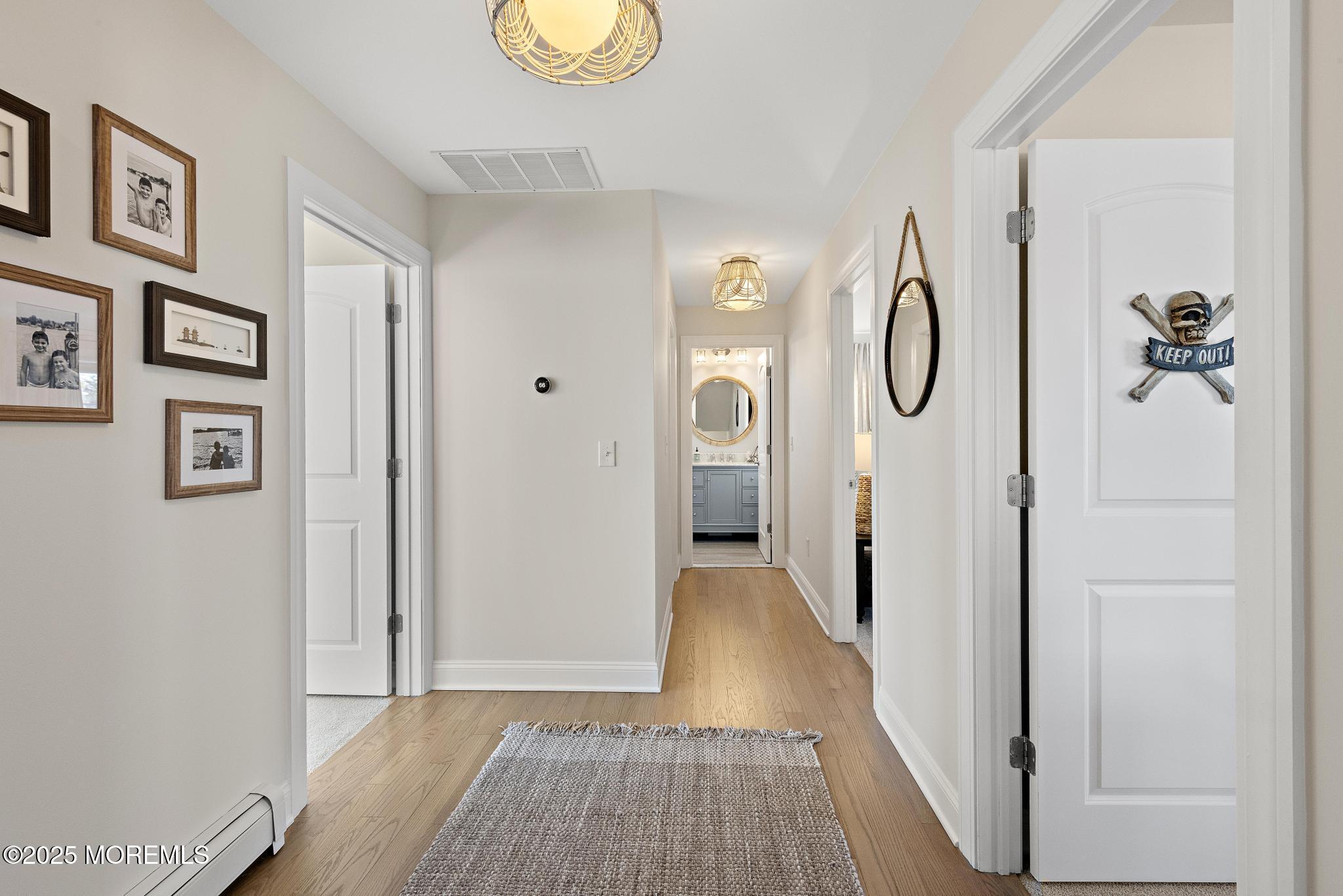 55 Bay Way Brick, NJ 08723 - Photo 12 of 29 a view of a hallway with wooden floor and staircase