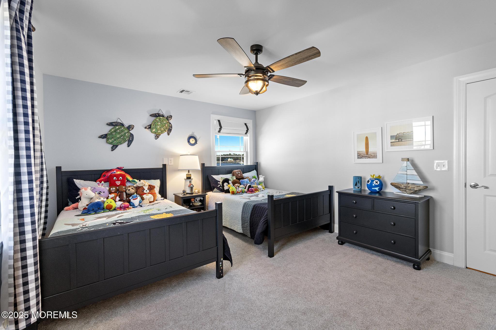 55 Bay Way Brick, NJ 08723 - Photo 13 of 29 a bed room with a bed and a window