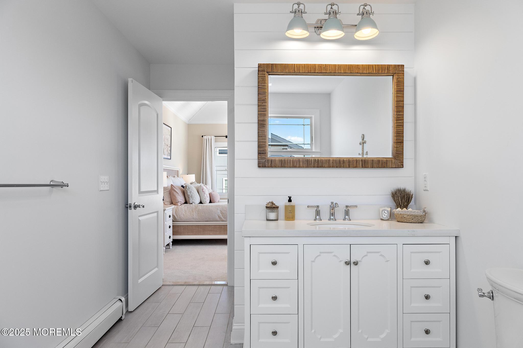 55 Bay Way Brick, NJ 08723 - Photo 17 of 29 a en suite bathroom with a toilet sink and mirror