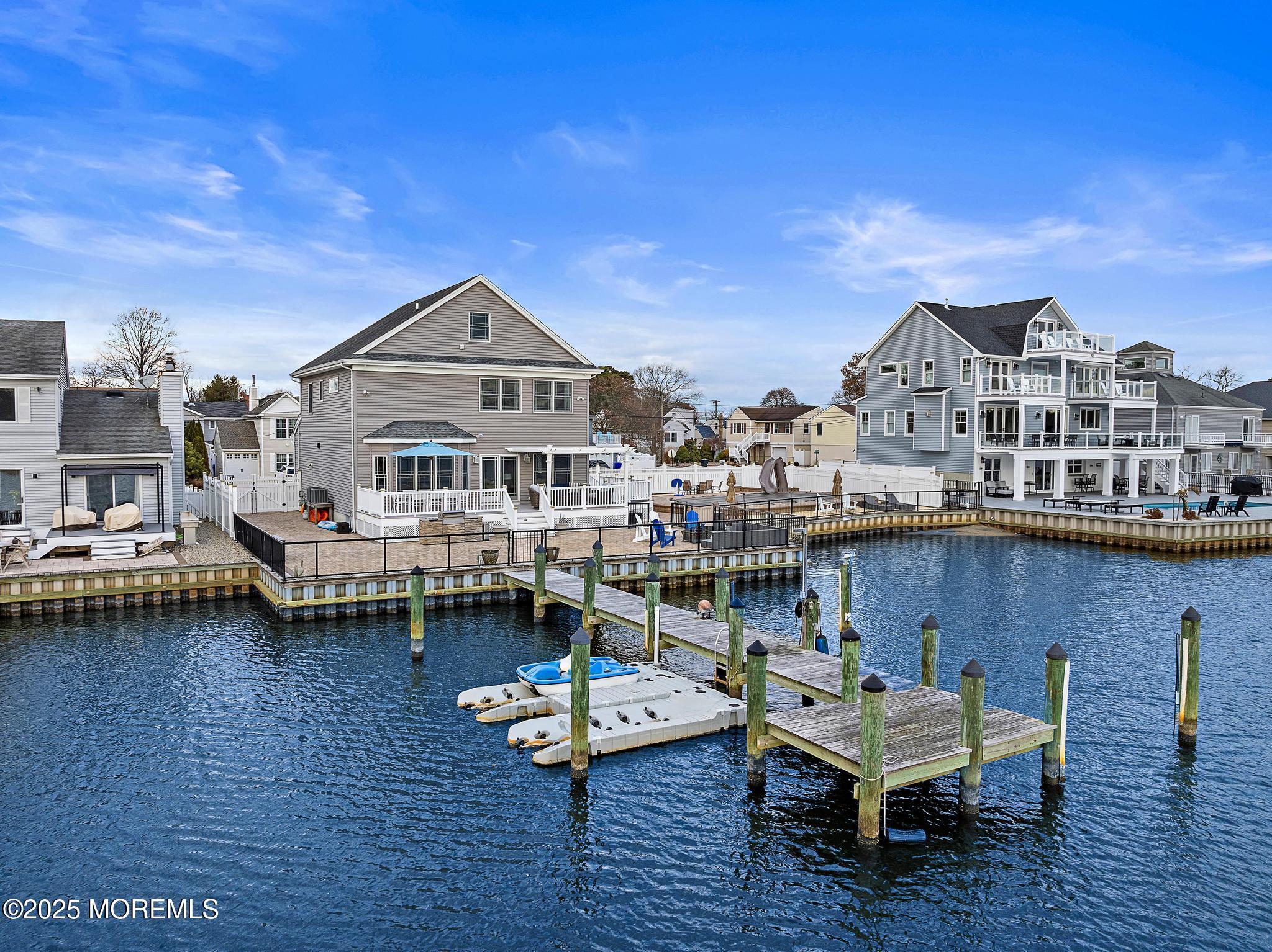 55 Bay Way Brick, NJ 08723 - Photo 22 of 29 a balcony with wooden floor and outdoor seating