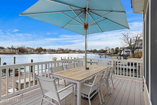 an outdoor space with furniture and umbrella
