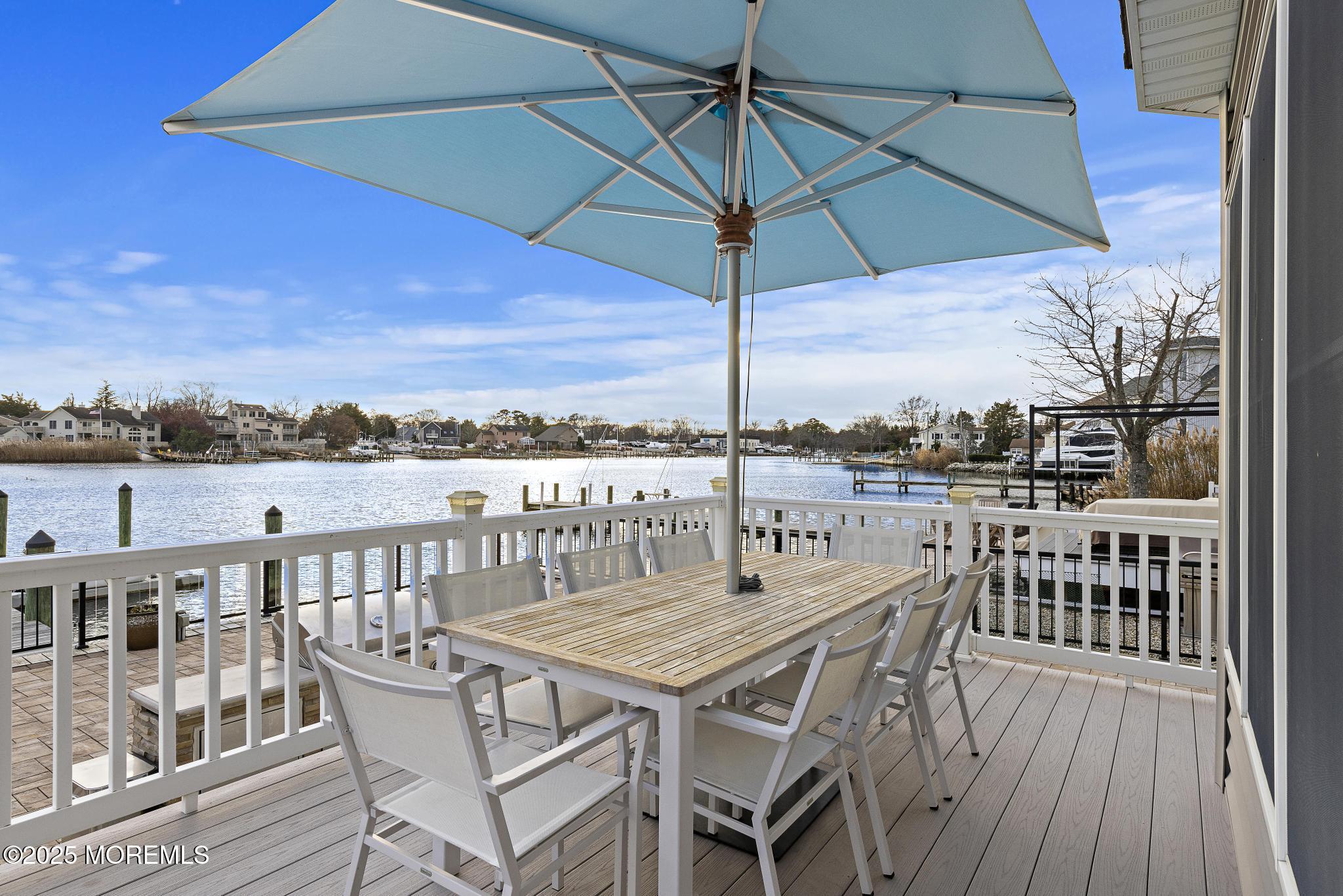 55 Bay Way Brick, NJ 08723 - Photo 23 of 29 an outdoor space with furniture and umbrella