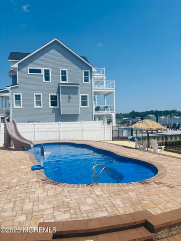 a view of a house with swimming pool