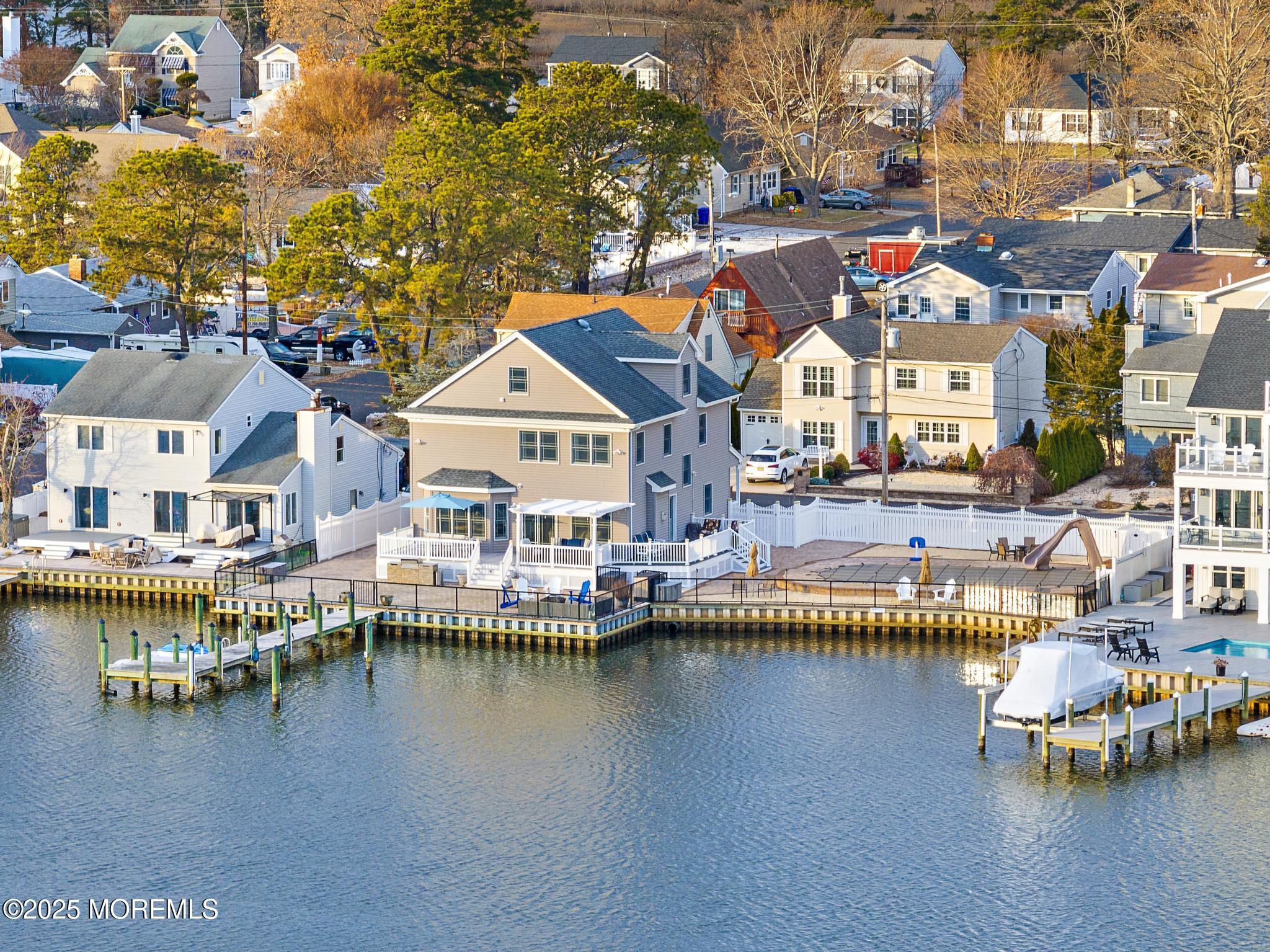 55 Bay Way Brick, NJ 08723 - Photo 27 of 29 a aerial view of residential houses with outdoor space and lake view