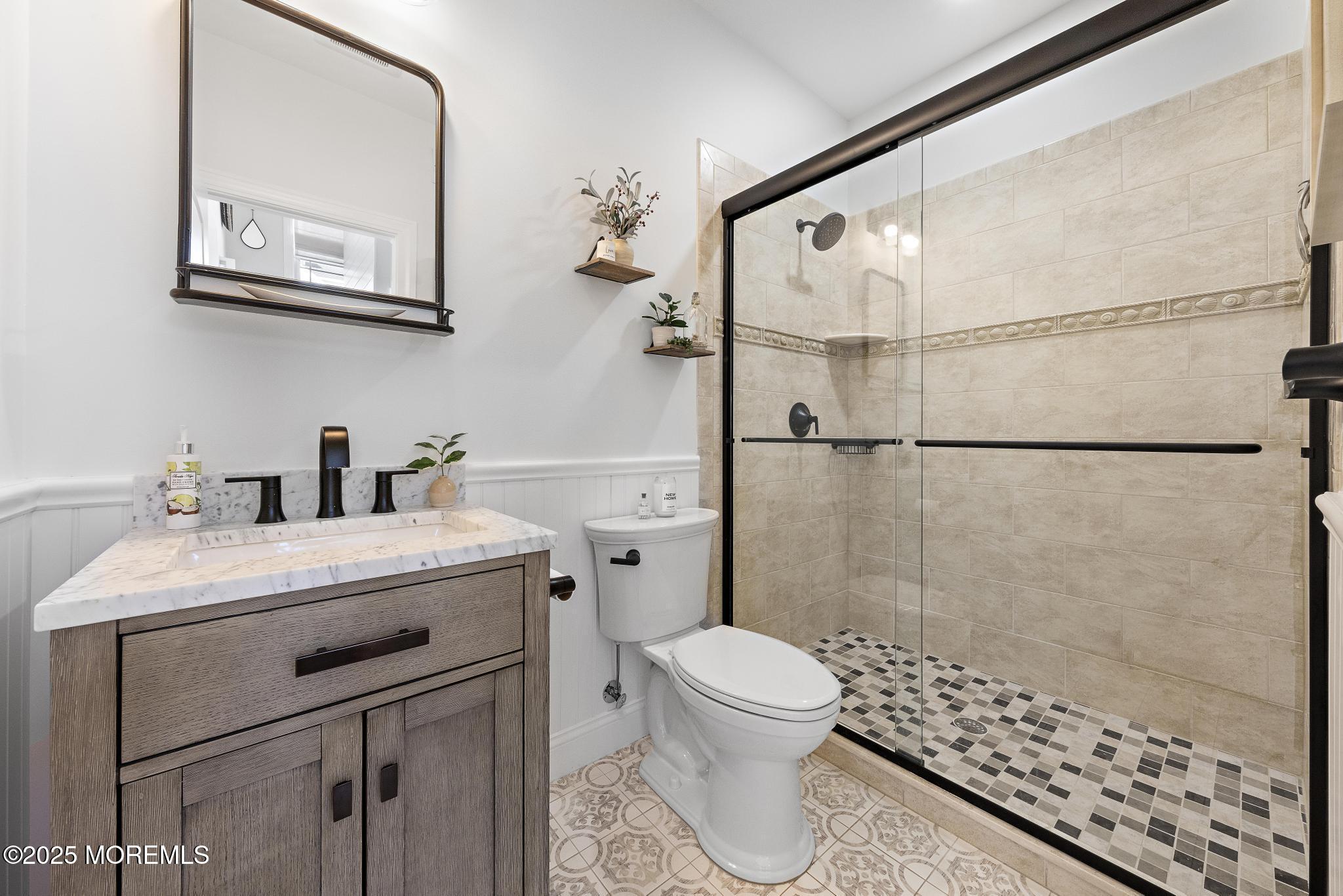 55 Bay Way Brick, NJ 08723 - Photo 4 of 29 a bathroom with a sink a toilet and shower