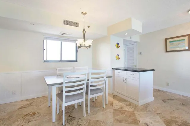 a kitchen with a table and chairs in it