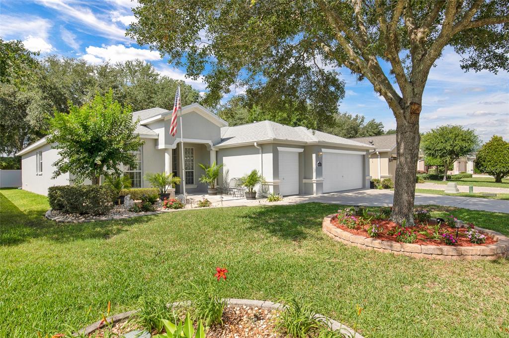 16411 Southwest 14th Avenue Road Ocala, FL 34473 - Photo 52 of 59 a front view of a house with garden