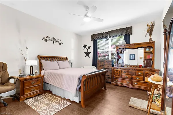 a bedroom with bed and window