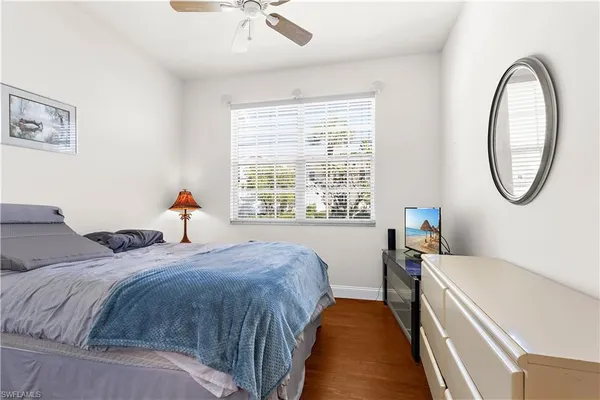 a bed room with a bed and a chandelier