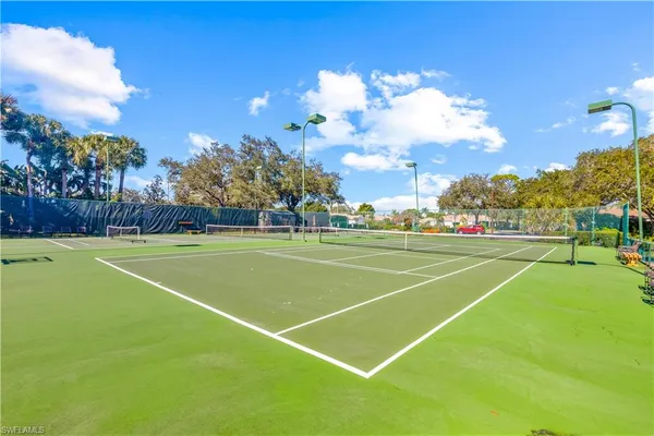 a view of an outdoor space and tennis court
