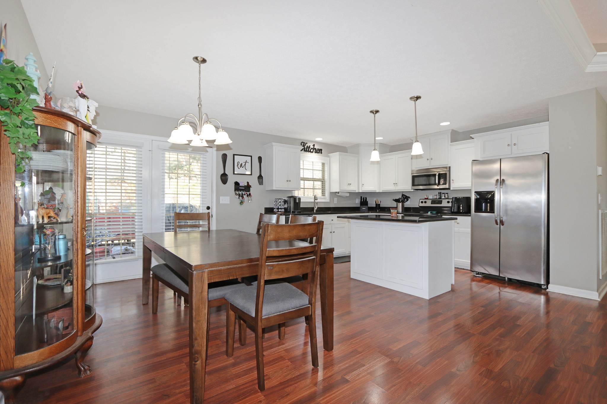 12 Haven Way Westmoreland, TN 37186 - Photo 10 of 16 a kitchen with stainless steel appliances kitchen island granite countertop a table chairs and a refrigerator