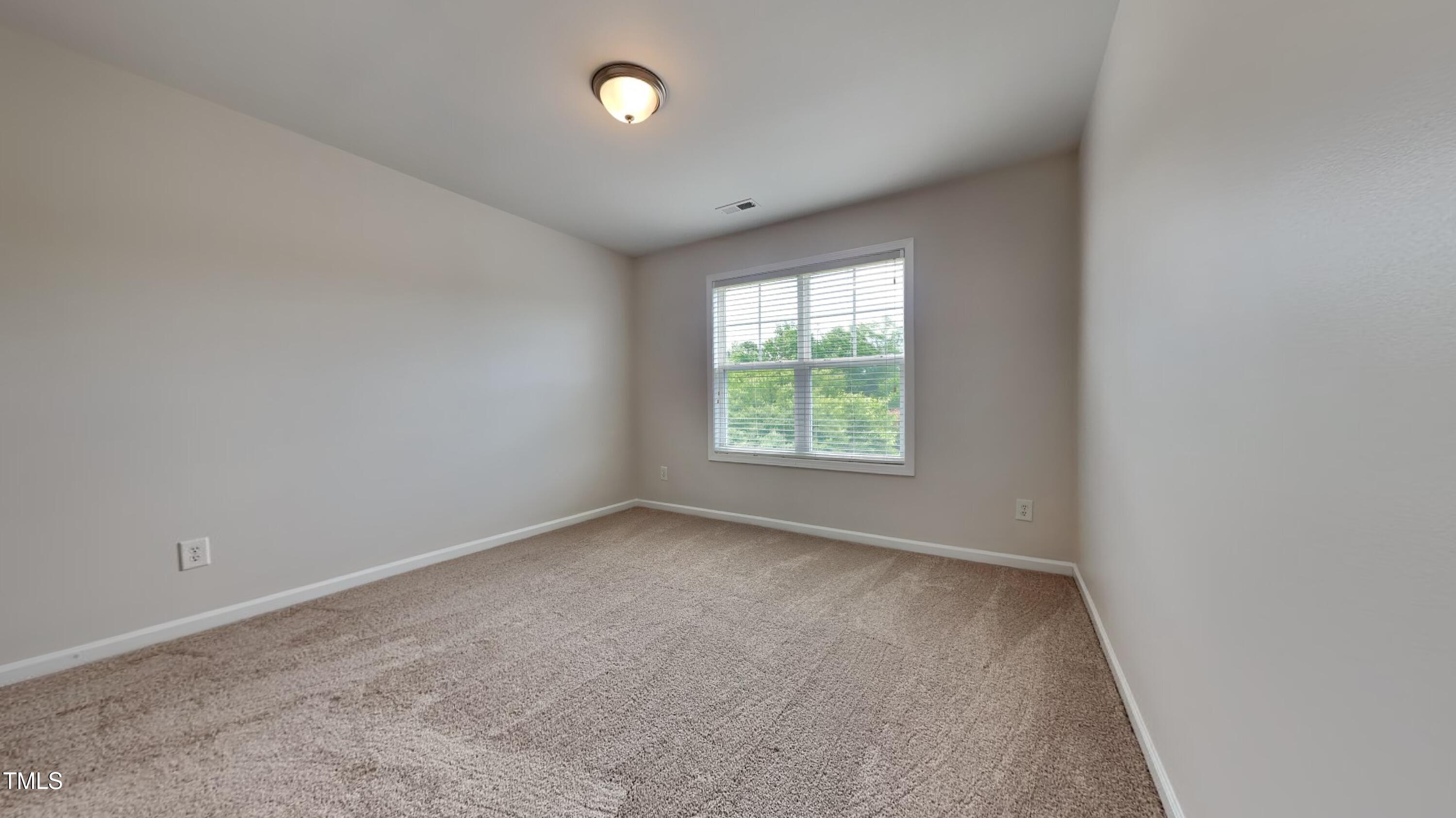 9037 Linslade Way Wake Forest, NC 27587 - Photo 12 of 16 an empty room with windows