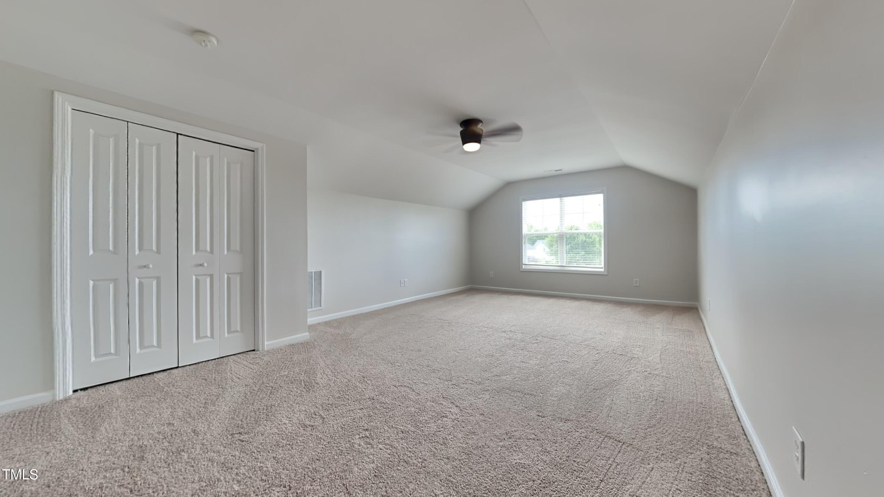 9037 Linslade Way Wake Forest, NC 27587 - Photo 15 of 16 a view of an empty room with a window