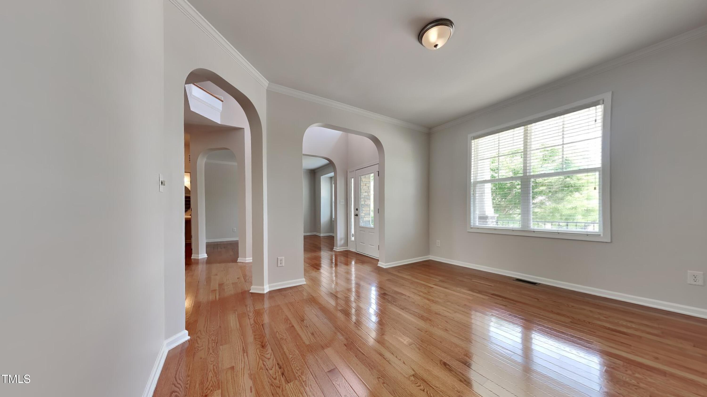 9037 Linslade Way Wake Forest, NC 27587 - Photo 2 of 16 a view of a room with wooden floor and a window