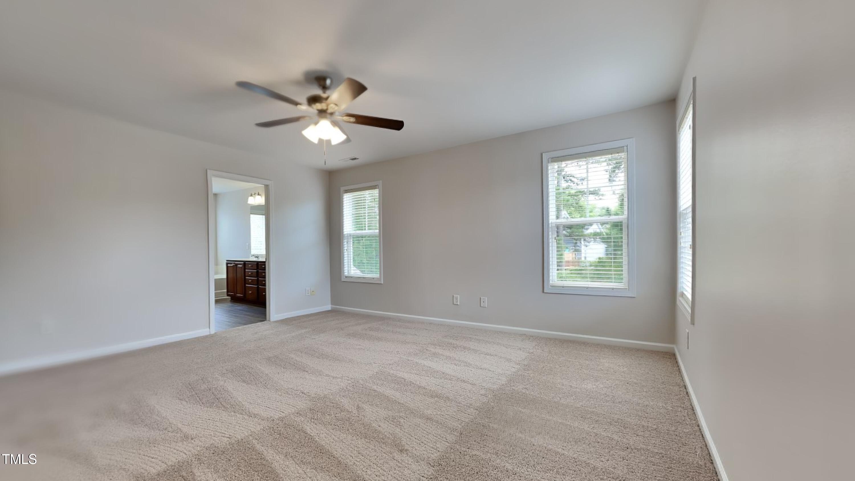 9037 Linslade Way Wake Forest, NC 27587 - Photo 8 of 16 a view of an empty room with a window