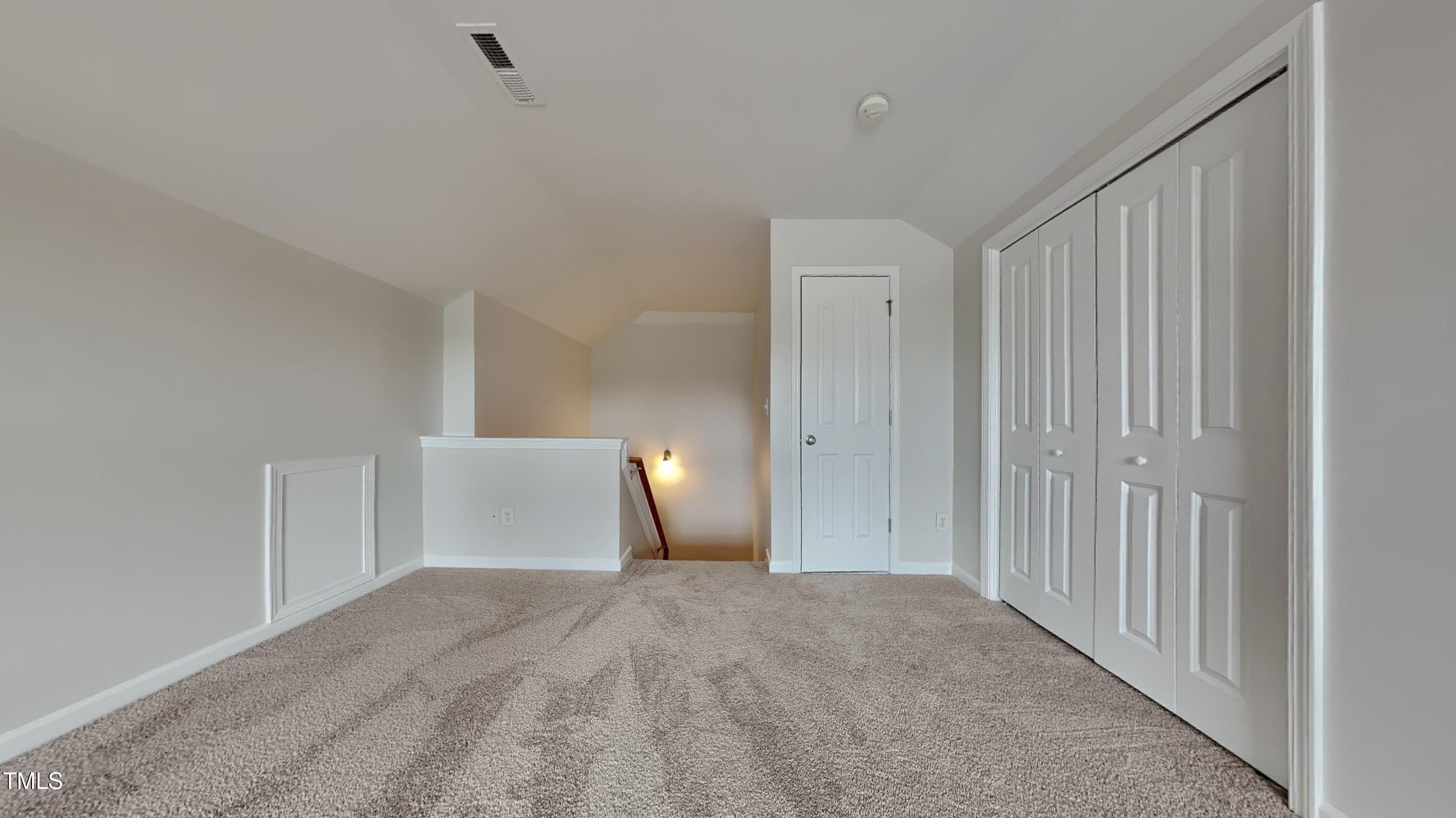 9037 Linslade Way Wake Forest, NC 27587 - Photo 10 of 16 a view of a room with a refrigerator and cabinet