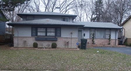3430 Maple Lane Hazel Crest, IL 60429 - Photo 1 of 1 a front view of a house with garden