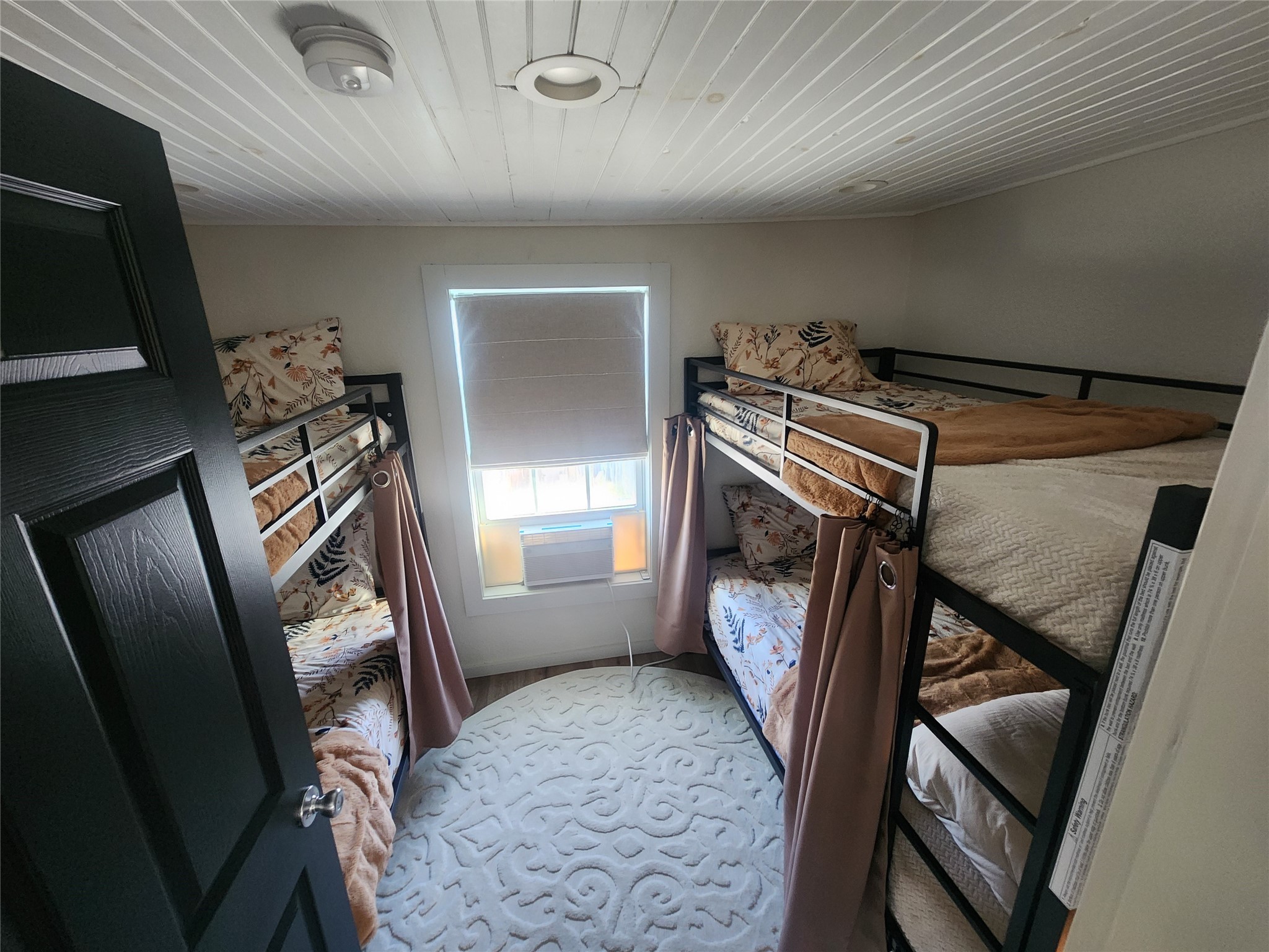 1061 North Sage Road Port Bolivar, TX 77650 - Photo 13 of 21 a view of a hallway with furniture and a ceiling fan