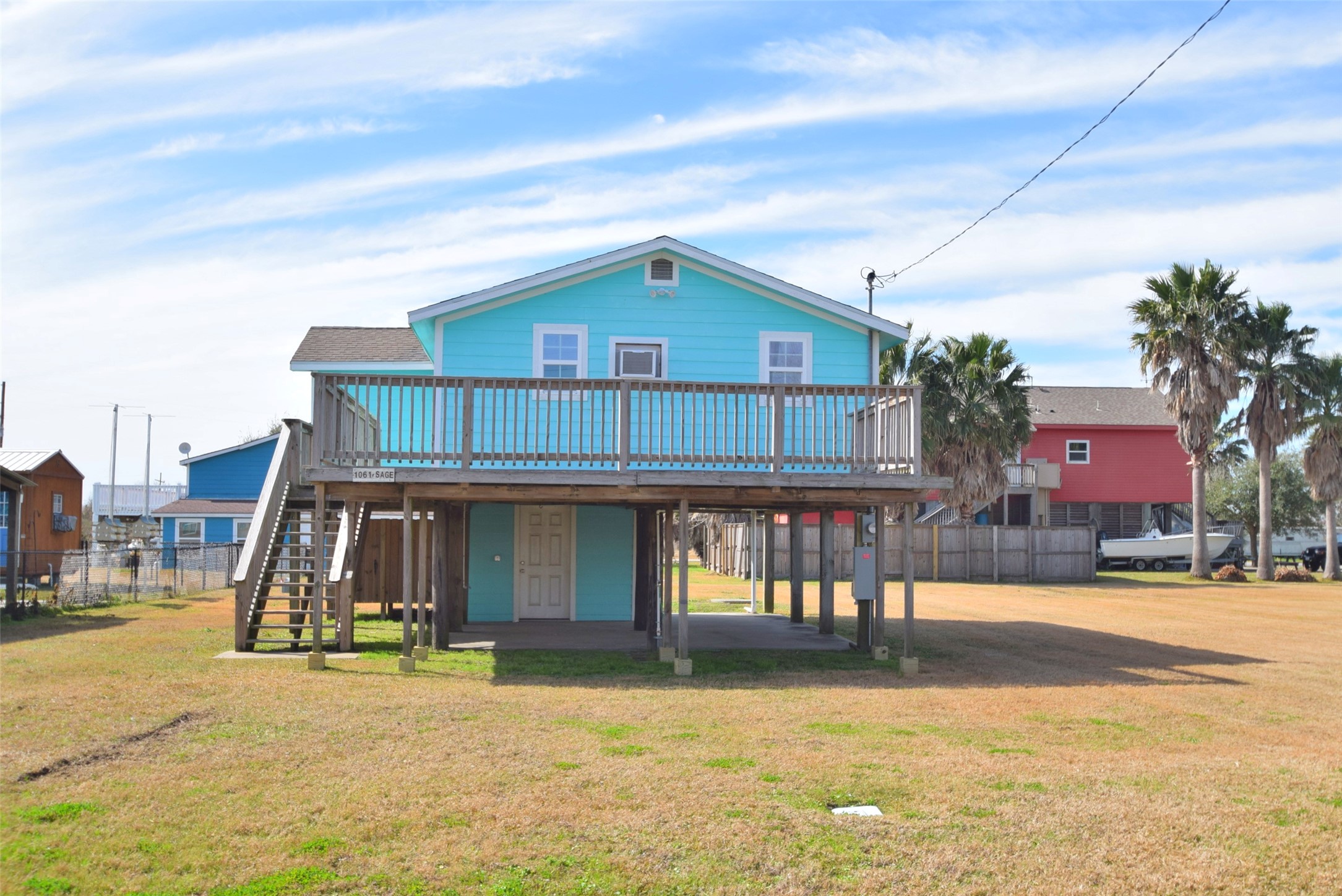 1061 North Sage Road Port Bolivar, TX 77650 - Photo 4 of 21 a front view of a house with swimming pool