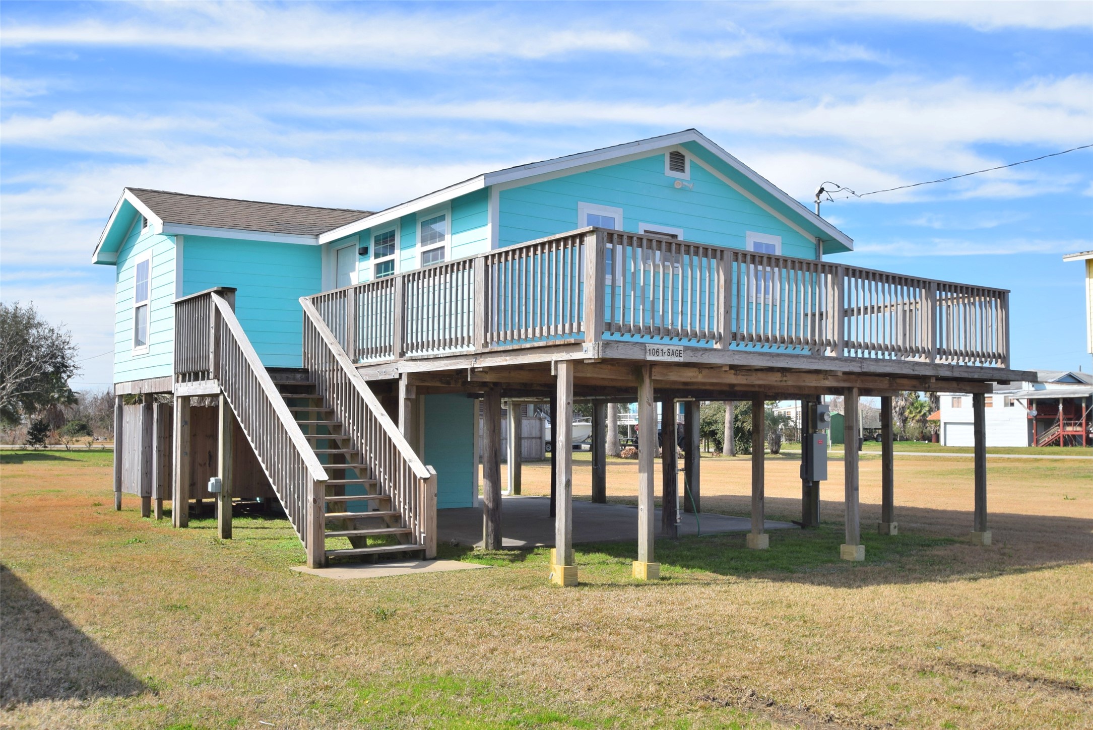 1061 North Sage Road Port Bolivar, TX 77650 - Photo 5 of 21 a view of a house with wooden stairs