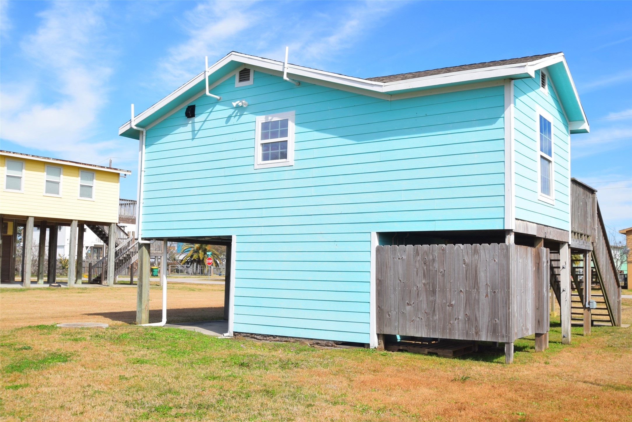 1061 North Sage Road Port Bolivar, TX 77650 - Photo 7 of 21 a view of a house with wooden fence