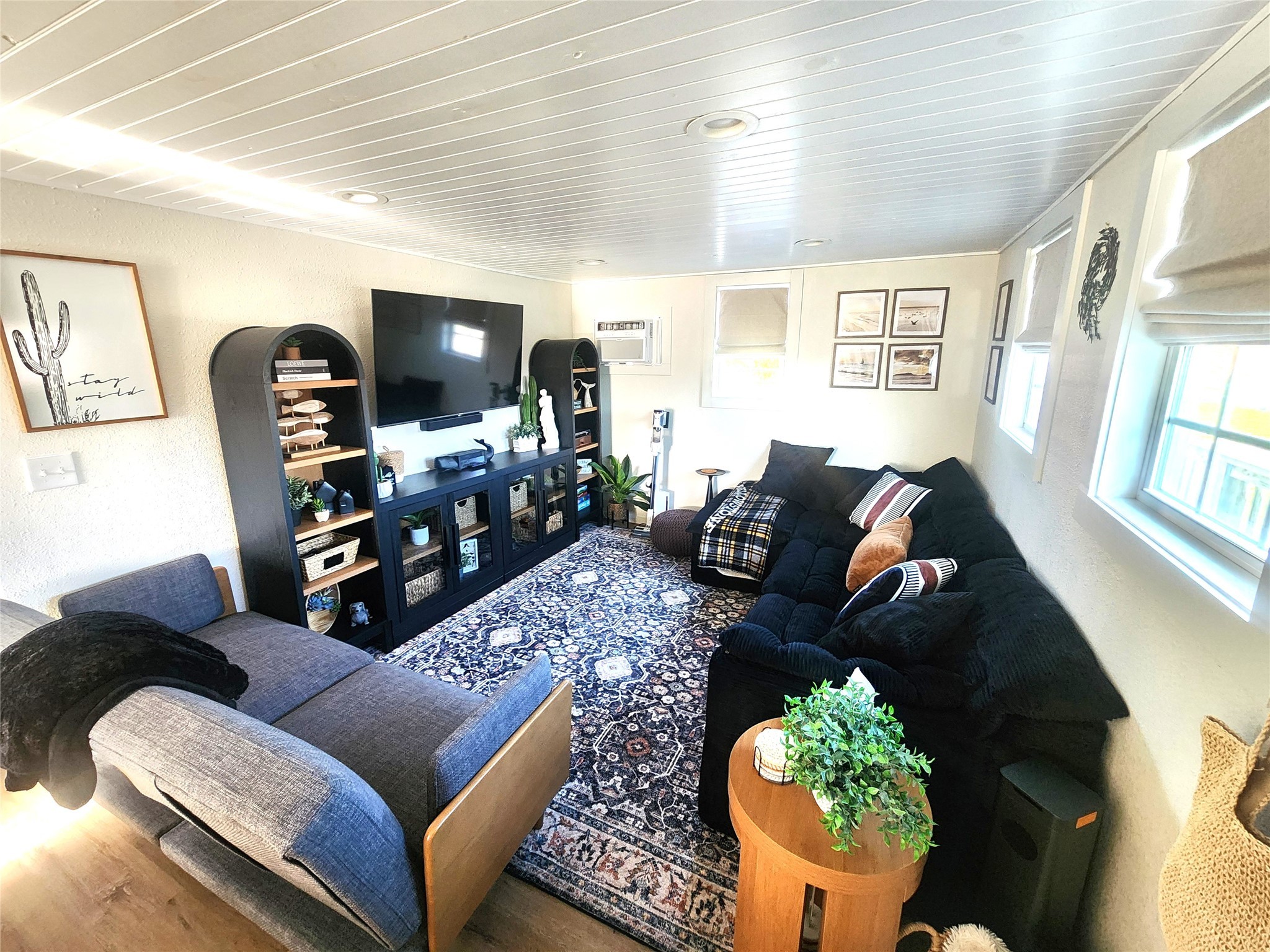 1061 North Sage Road Port Bolivar, TX 77650 - Photo 9 of 21 a living room with furniture and a flat screen tv