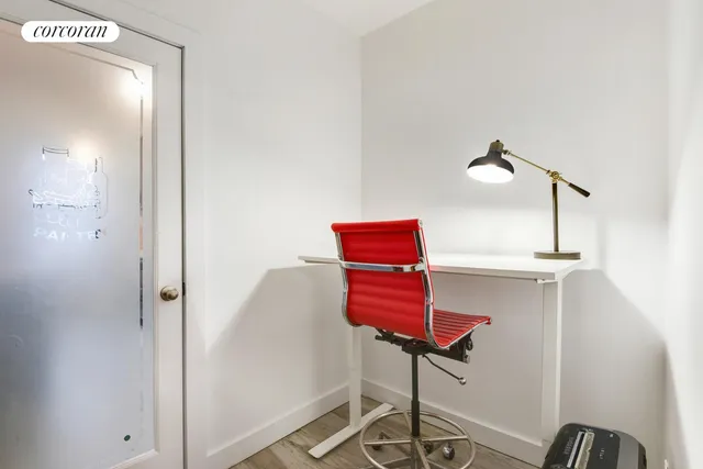 a balcony with lots of cabinets and wooden floor