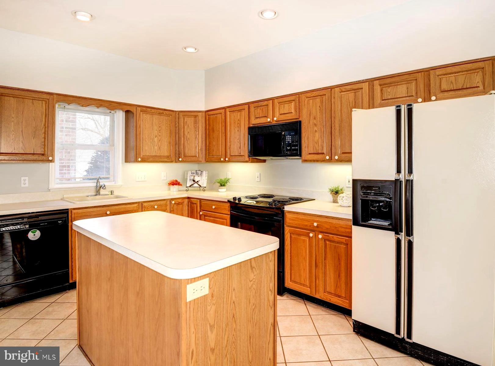 1173 Turkey Point Road Edgewater, MD 21037 - Photo 14 of 43 Dine-In Kitchen with Wood Storage Cabinetry