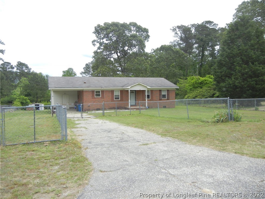 648 Pleasant Loop Fayetteville, NC 28311 - Photo 3 of 20 a view of a house with a backyard