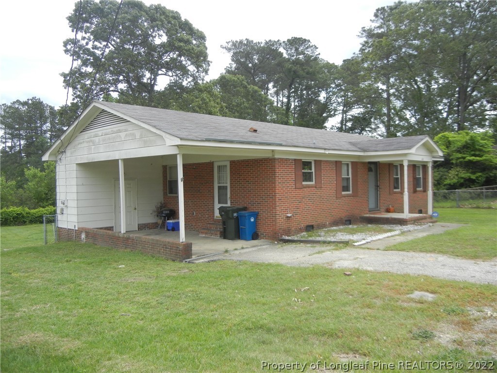 648 Pleasant Loop Fayetteville, NC 28311 - Photo 4 of 20 a view of a house with a yard and large tree