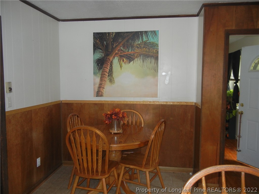 648 Pleasant Loop Fayetteville, NC 28311 - Photo 10 of 20 a view of a dining room with furniture