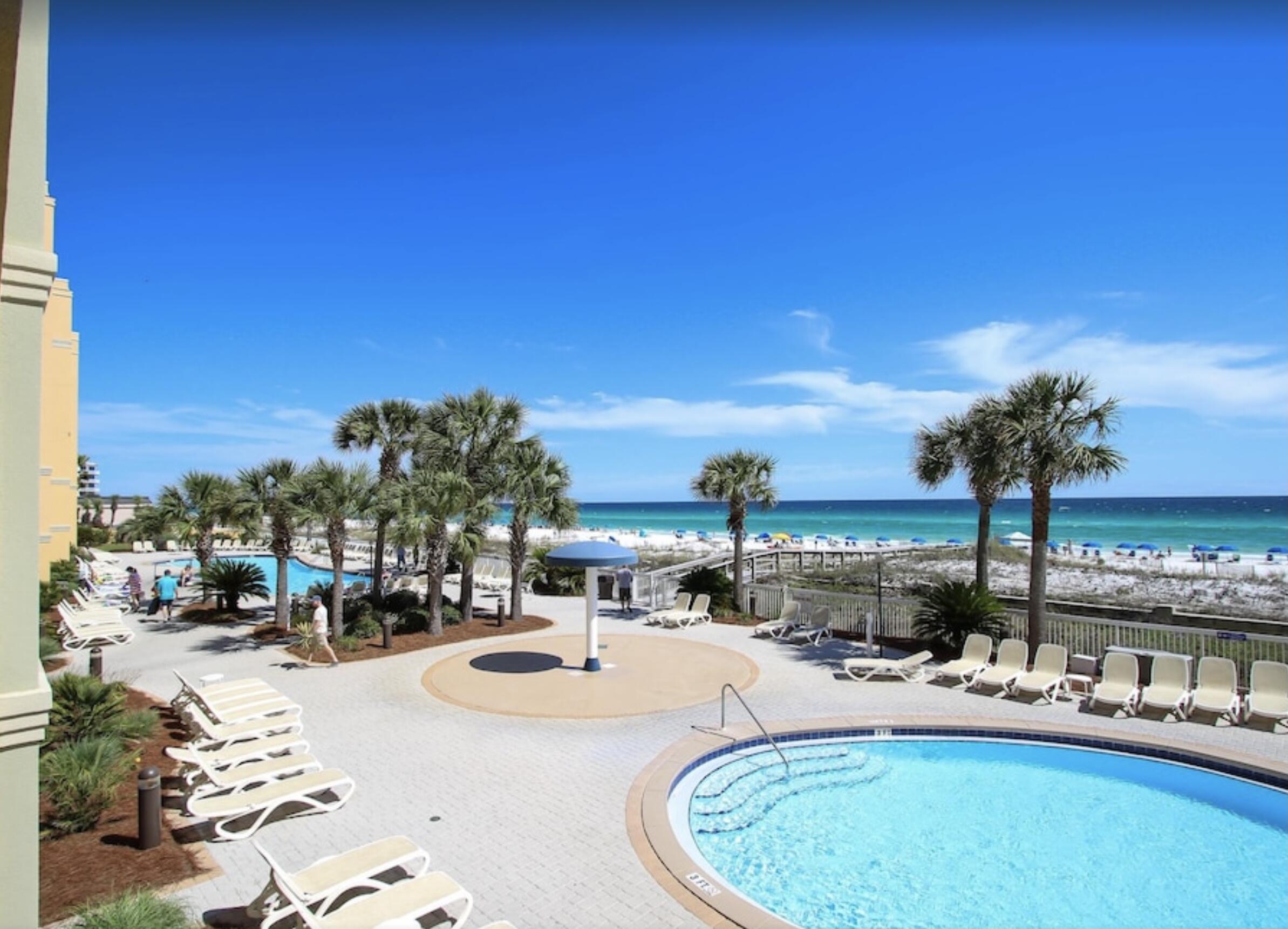 1150 Santa Rosa Boulevard, Unit 211 Fort Walton Beach, FL 32548 - Photo 7 of 7 a view of swimming pool with outdoor seating and city view