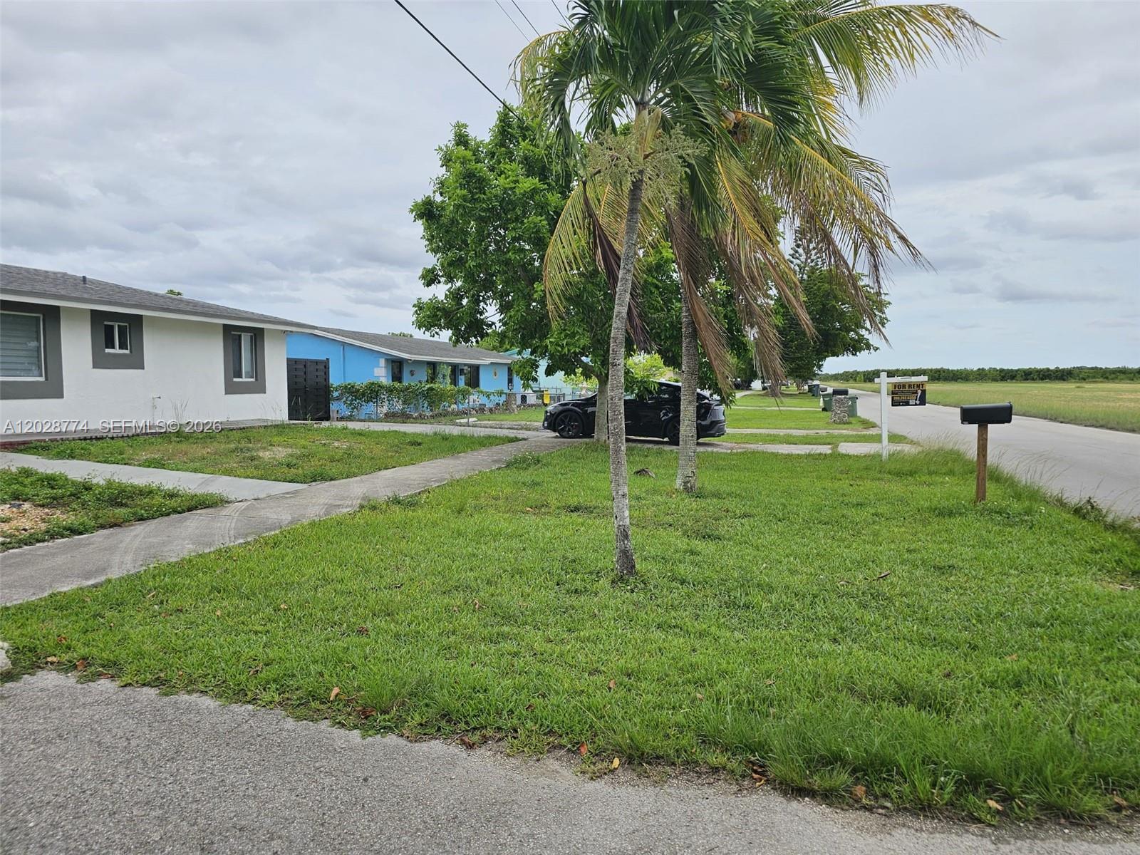 75 Southwest 18th Avenue Homestead, FL 33030 - Photo 4 of 31 a view of a house with a backyard