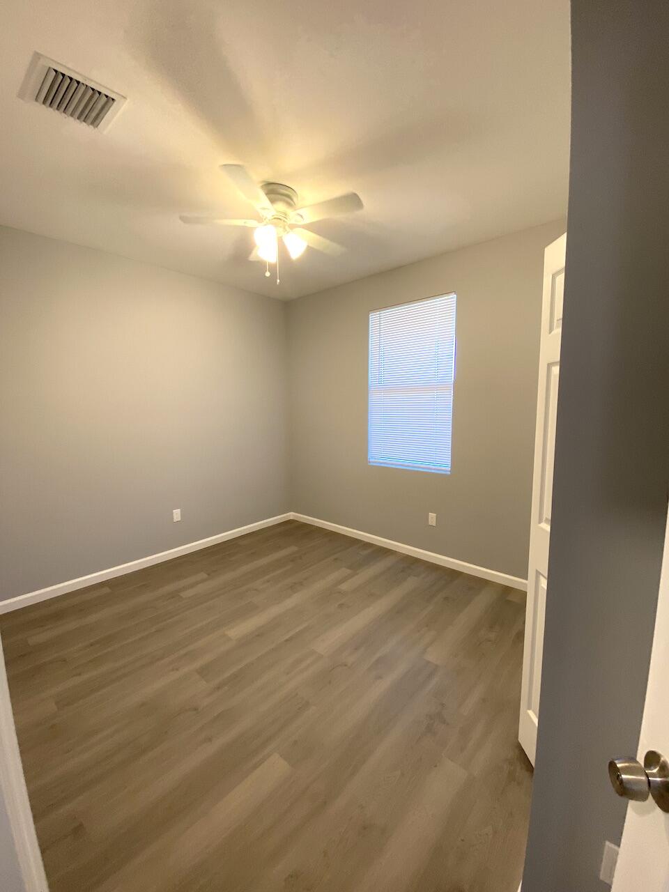 514 Northwest 11th Avenue Boynton Beach, FL 33435 - Photo 15 of 18 an empty room with a empty space and a window