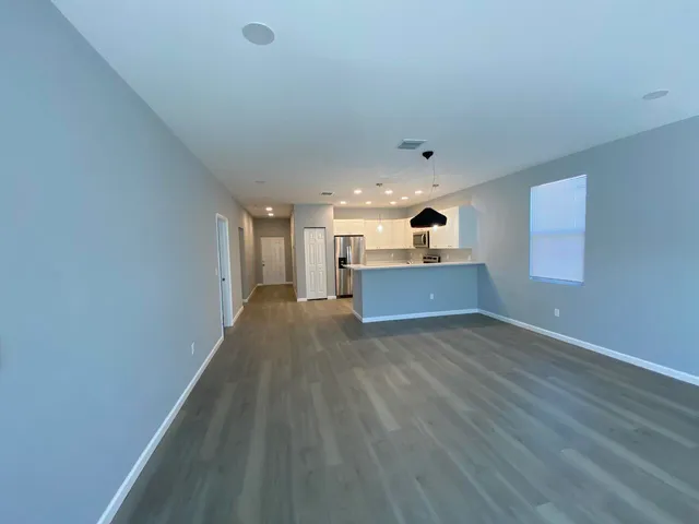 a view of kitchen and wooden floor