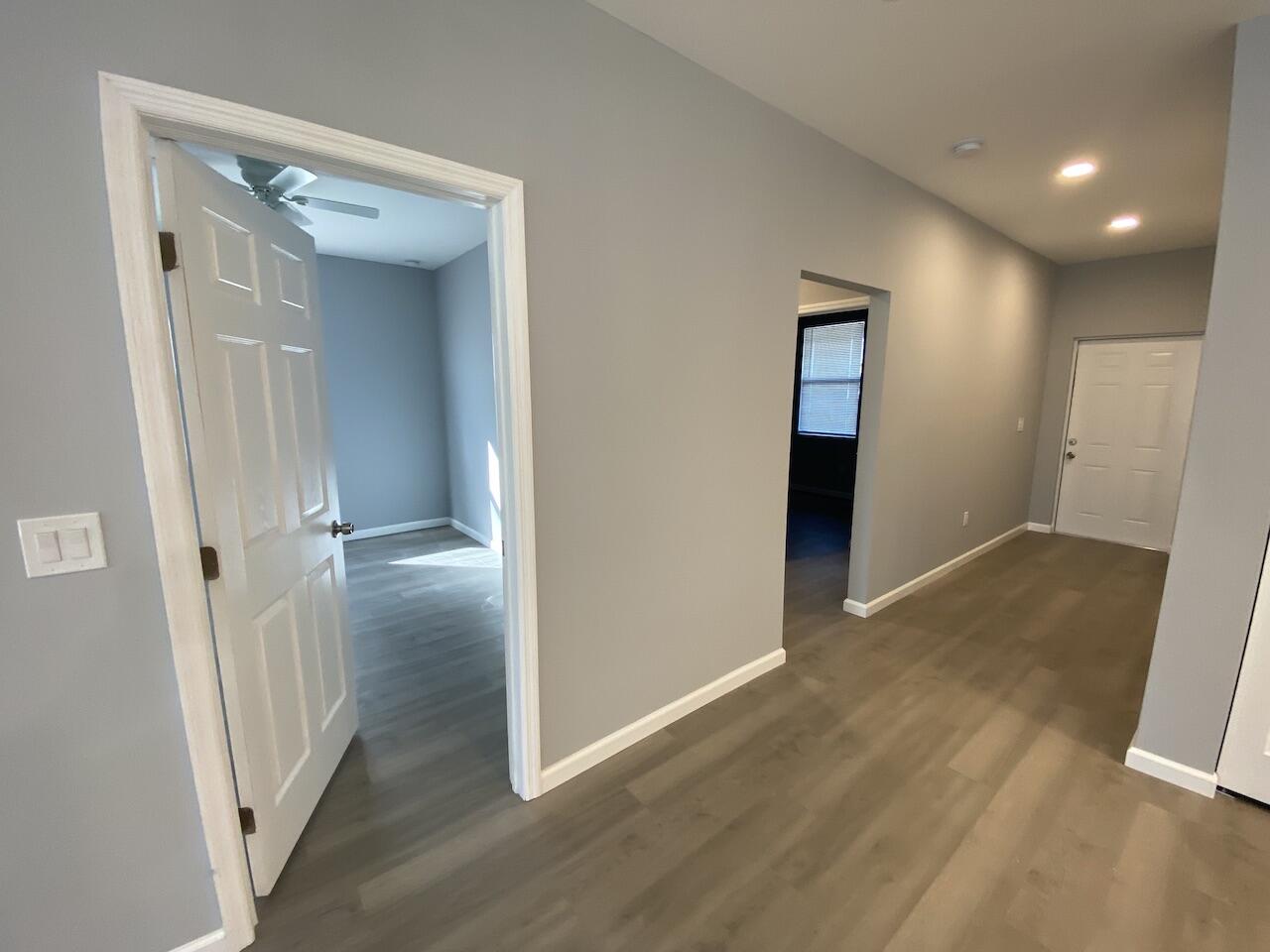 514 Northwest 11th Avenue Boynton Beach, FL 33435 - Photo 7 of 18 a view of a hallway with wooden floor