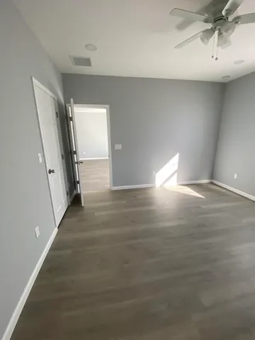 a view of a hallway with staircase