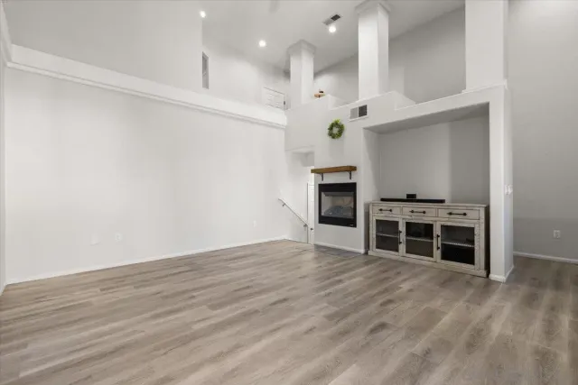 a view of kitchen with furniture and wooden floor