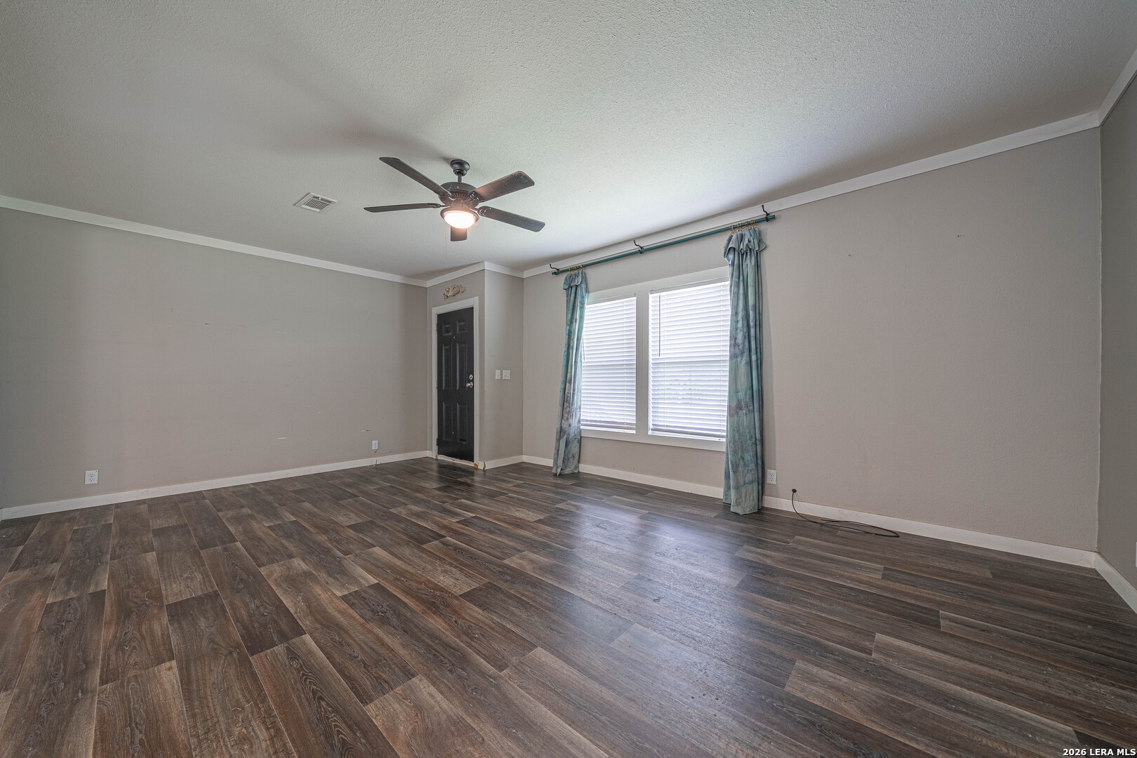 3433 Gander Slough Road Kingsbury, TX 78638 - Photo 9 of 23 a view of empty room with wooden floor and fan