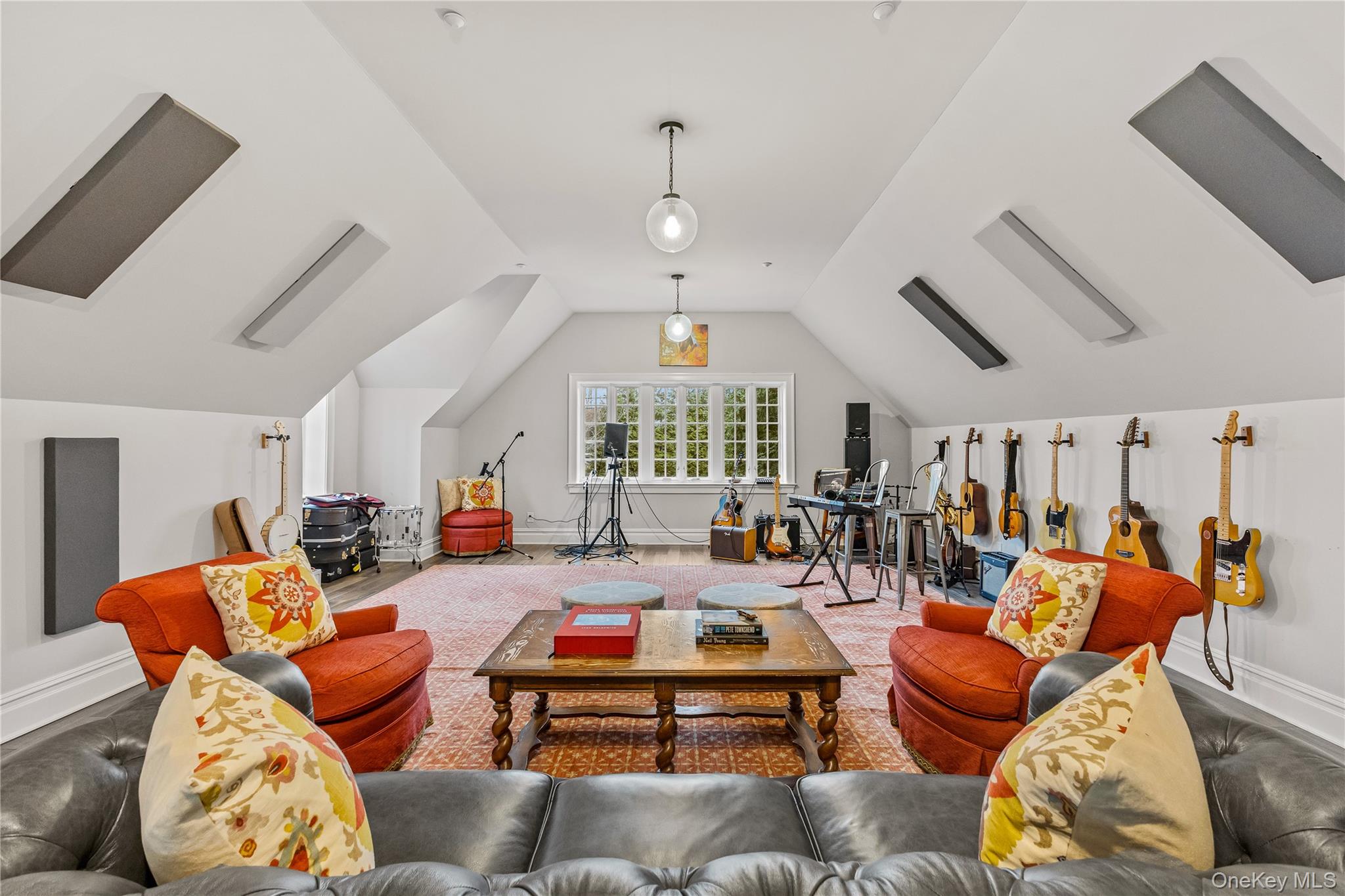19 Park Drive South Rye, NY 10580 - Photo 41 of 42 Versatile bonus room makes a premier creative studio with acoustic treatments and flexible layout. Bright windows and vaulted ceilings create an airy retreat for work or play.