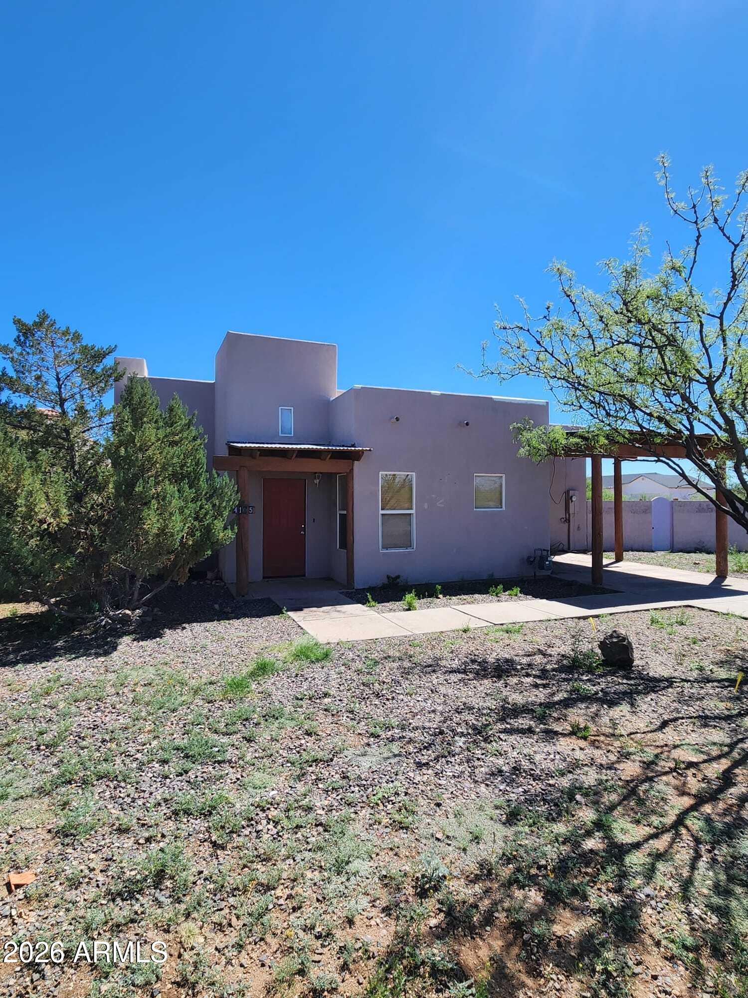 4105 North Washington Avenue Douglas, AZ 85607 - Photo 1 of 61 a house with trees in front of it