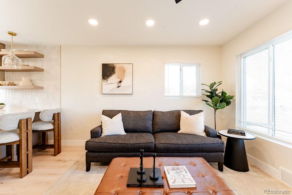 1105 South Raleigh Street Denver, CO 80219 - Photo 14 of 23 a living room with furniture and a potted plant