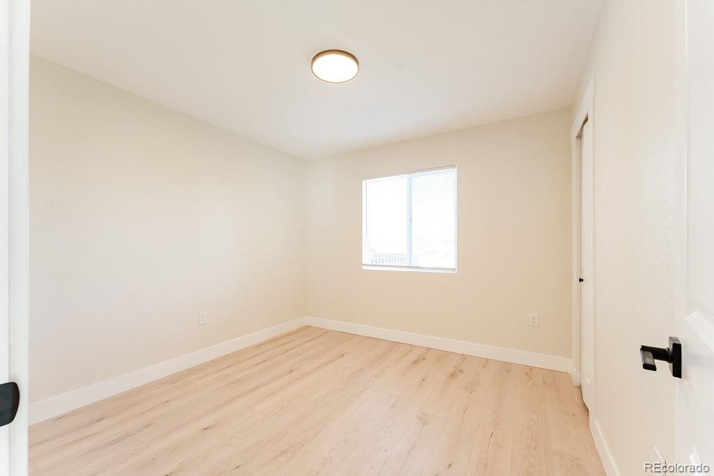 1105 South Raleigh Street Denver, CO 80219 - Photo 20 of 23 an empty room with a window