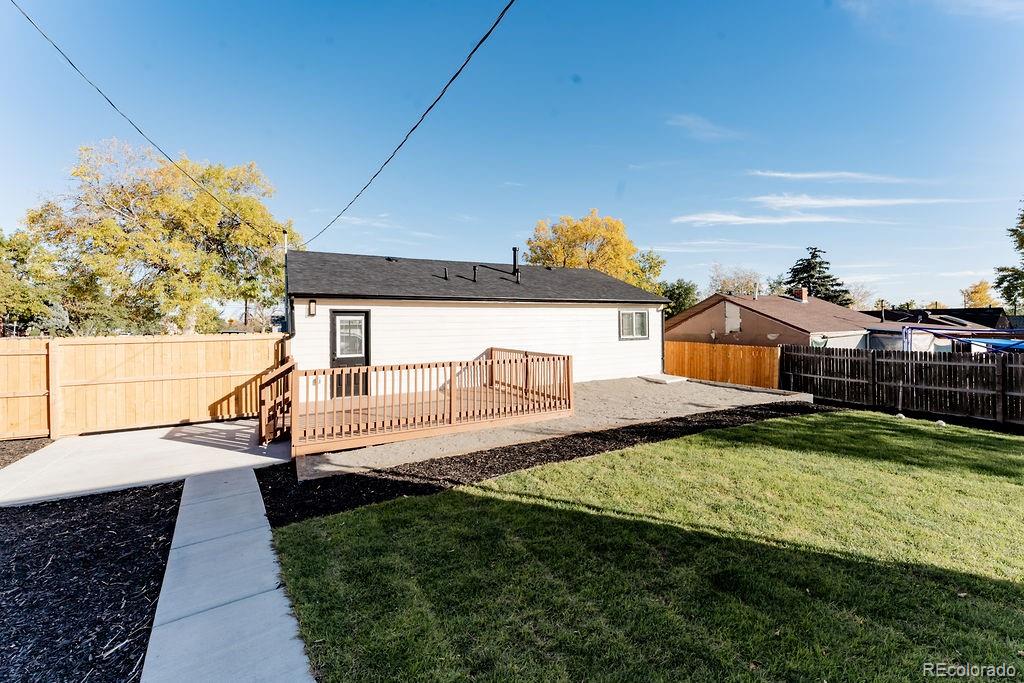 1105 South Raleigh Street Denver, CO 80219 - Photo 21 of 23 a view of a house with backyard and sitting area
