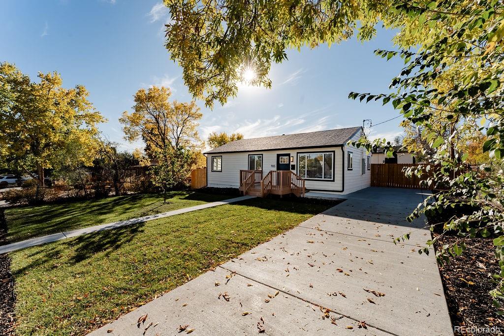 1105 South Raleigh Street Denver, CO 80219 - Photo 23 of 23 a front view of a house with a yard
